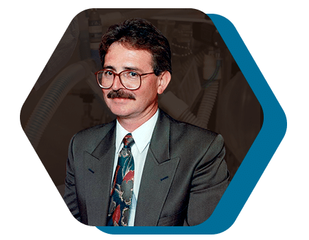 Dr. Juan Luis Prado, founder of JLPrado Clinic, confidently smiling in his medical attire.
