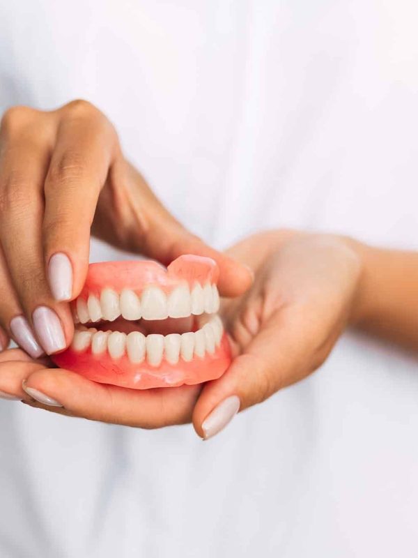 Front view of complete denture. Dentistry conceptual photo. Prosthetic dentistry. False teeth Front view of complete denture. Dentistry conceptual photo. Prosthetic dentistry. False teeth
